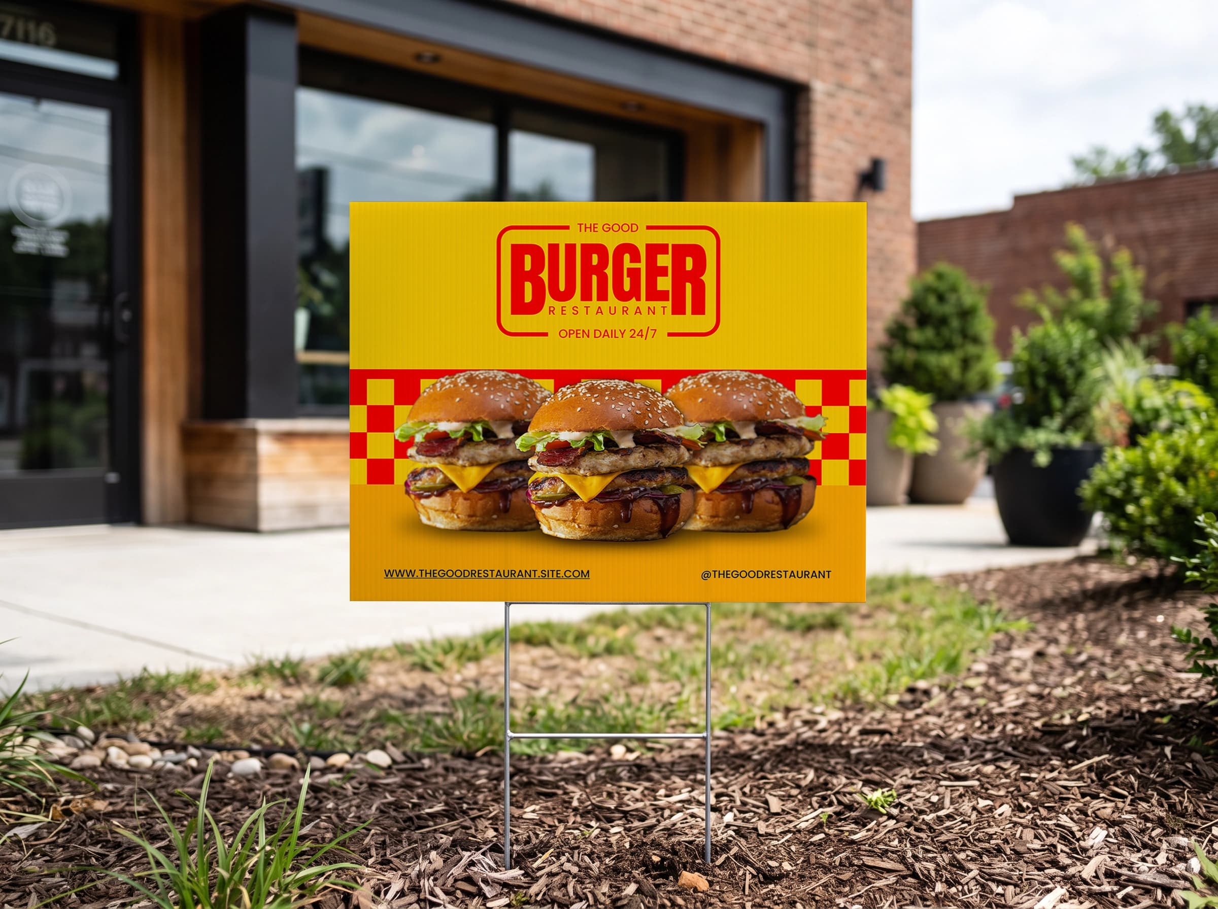 Burger restaurant yard sign in front of a brick building